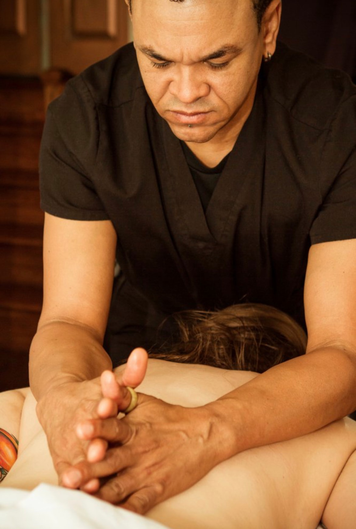 Therapeutic bodywork session with a tuning fork